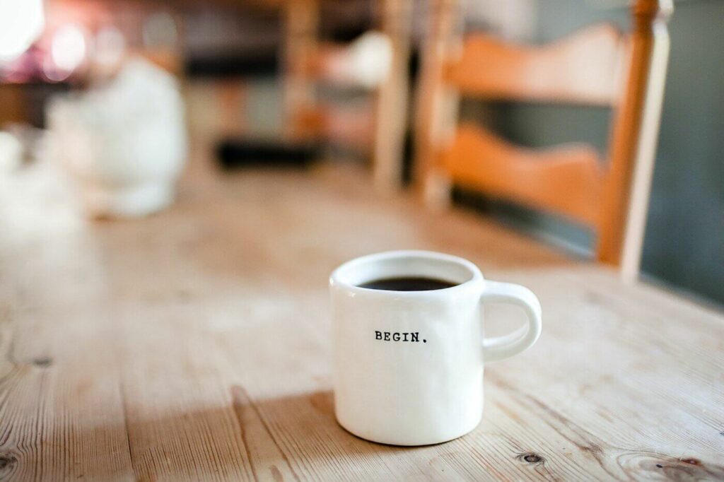 Alida Miranda-Wolff, How to Find the Right Therapist article, feature image, coffee cup with the word "begin." on it