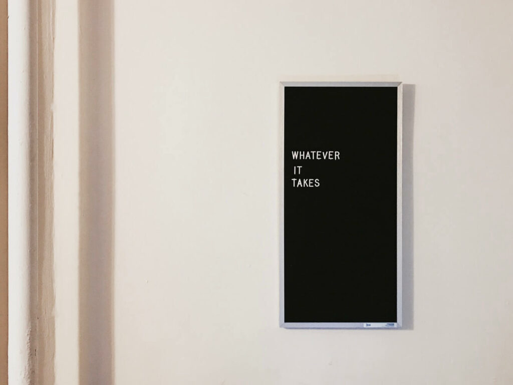 Alida Miranda-Wolff, Productivity: What Is It For? article, feature image, letter board hanging on wall that says "whatever it takes"