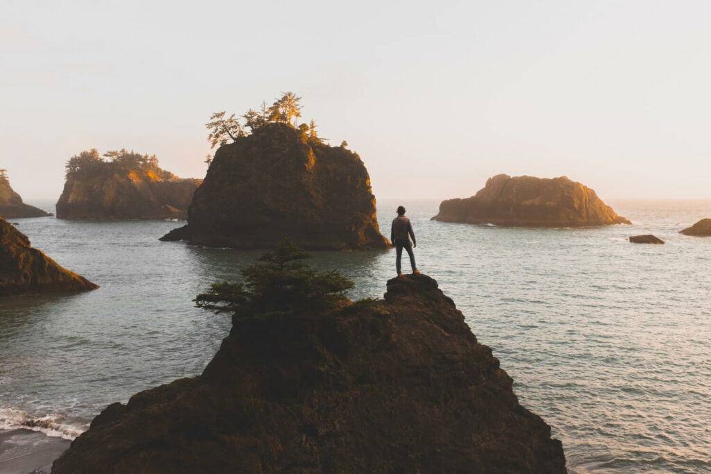 Alida Miranda-Wolff, Productivity: What Is It For? article image, man standing on top of a hill overlooking the water