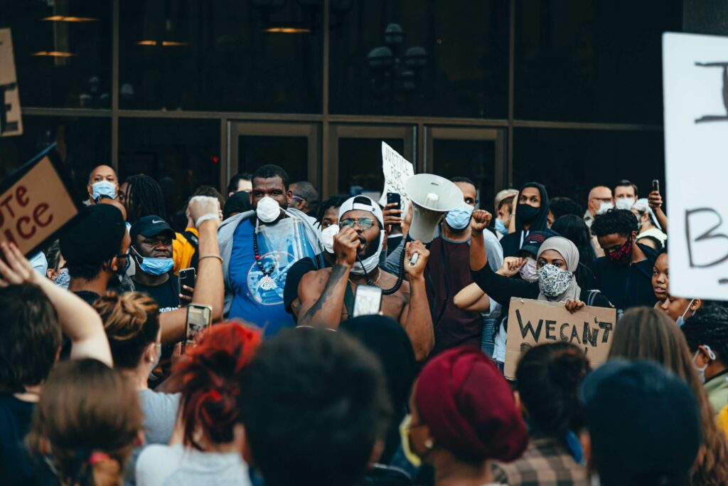 Alida Miranda-Wolff, We Stand Against White Supremacy and for Black Lives article, feature image, crowd of Black Lives Matter protesters holding signs